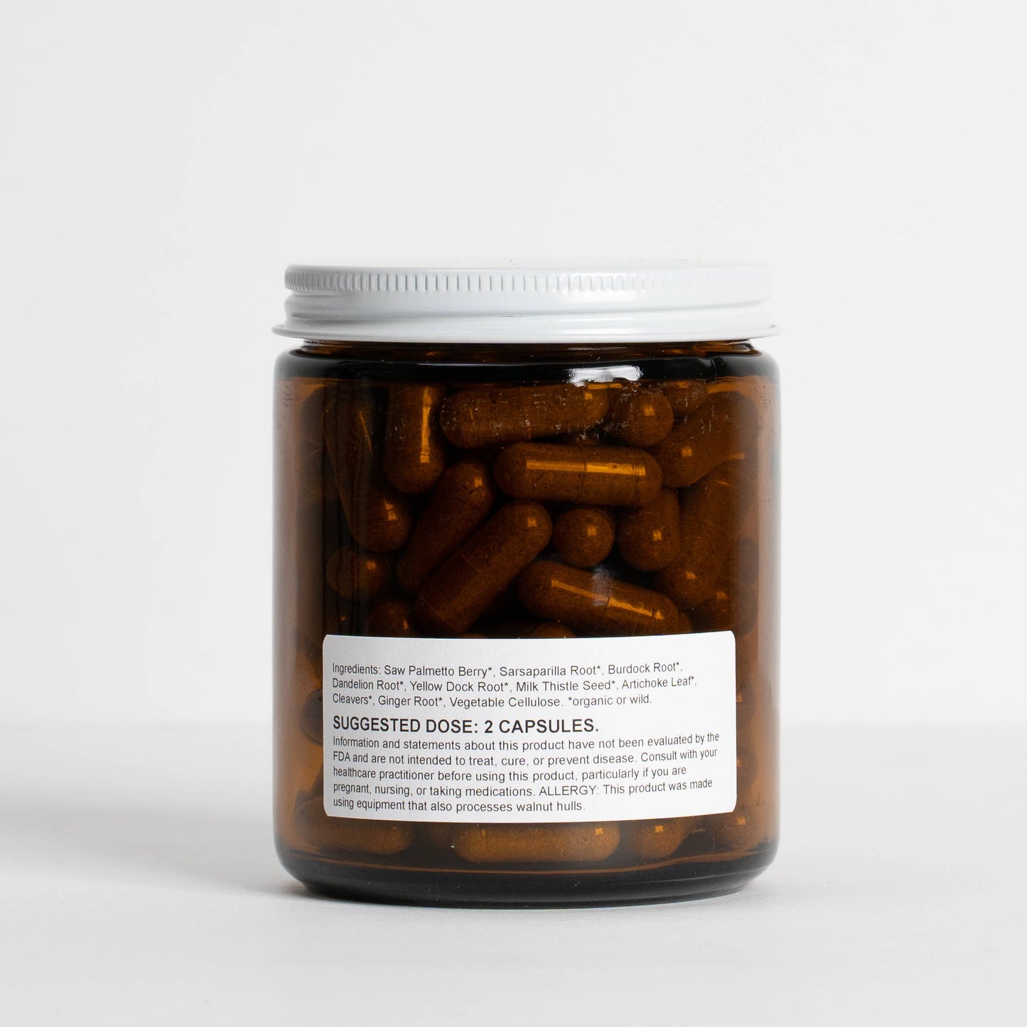 
                  
                    Back label of Food Over Drugs Cystic Acne Formula listing saw palmetto berry, sarsaparilla, burdock and dandelion root
                  
                